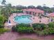 Resort-style pool with surrounding lounge chairs and patio area at 10494 Princess Ct, Punta Gorda, FL 33955