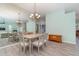 Dining area with a large mirror reflecting the living room at 10494 Princess Ct, Punta Gorda, FL 33955