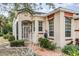 Front entrance with a metal gate and a paved pathway at 10494 Princess Ct, Punta Gorda, FL 33955