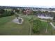 Golf course with clubhouse and palm trees at 10494 Princess Ct, Punta Gorda, FL 33955