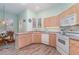 Eat-in kitchen with light wood cabinets and a corner sink at 10494 Princess Ct, Punta Gorda, FL 33955