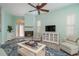 Living room with fireplace, light walls, and comfy seating at 10494 Princess Ct, Punta Gorda, FL 33955