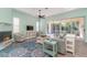 Living room with pool view and sliding glass doors at 10494 Princess Ct, Punta Gorda, FL 33955