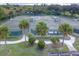 Well-maintained tennis courts with palm trees and ample seating at 10494 Princess Ct, Punta Gorda, FL 33955