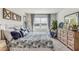 Spacious bedroom with lake view, dresser, and comfortable bedding at 1428 Powell Valley Dr, Port Charlotte, FL 33953