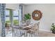 Bright dining room with table and chairs near sliding doors to patio at 1428 Powell Valley Dr, Port Charlotte, FL 33953