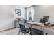 Bright home office with desk, chairs, and ample natural light at 1428 Powell Valley Dr, Port Charlotte, FL 33953