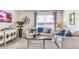 Spacious living room with large window, comfy seating, and stylish decor at 1428 Powell Valley Dr, Port Charlotte, FL 33953