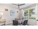 Home office with desk, chairs, and window overlooking the backyard at 1428 Powell Valley Dr, Port Charlotte, FL 33953