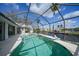 Enjoy this refreshing pool and spa with a canal view at 1600 Redwing Ct, Punta Gorda, FL 33950