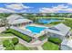 Community pool and clubhouse with surrounding landscape at 2051 Royal Tern Cir, Punta Gorda, FL 33983