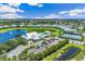 Aerial view showing community pool, tennis courts, and clubhouse at 2051 Royal Tern Cir, Punta Gorda, FL 33983