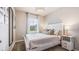 Bright bedroom with a queen-size bed and window at 2051 Royal Tern Cir, Punta Gorda, FL 33983