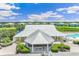 Community clubhouse with a metal roof and landscaping at 2051 Royal Tern Cir, Punta Gorda, FL 33983
