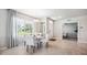 Bright dining area with white chairs and a round dining table at 2051 Royal Tern Cir, Punta Gorda, FL 33983