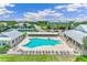 Community pool with a large deck and ample seating at 2051 Royal Tern Cir, Punta Gorda, FL 33983