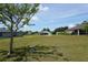 Expansive backyard view with lush green grass, offering ample space and potential for outdoor activities at 25115 Esmeralda Ct, Punta Gorda, FL 33955