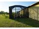 View of backyard with screened enclosure at 25115 Esmeralda Ct, Punta Gorda, FL 33955