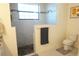 Bathroom with walk-in shower, toilet, and granite countertop at 25115 Esmeralda Ct, Punta Gorda, FL 33955