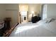 Main bedroom with a king-size bed and en-suite bathroom at 25115 Esmeralda Ct, Punta Gorda, FL 33955