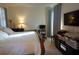 Spacious bedroom with a large bed, TV, and ample space at 25115 Esmeralda Ct, Punta Gorda, FL 33955