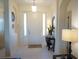 Bright and airy entryway with a console table and mirror at 25115 Esmeralda Ct, Punta Gorda, FL 33955