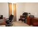Home office with desk, chair, and built-in shelving at 25115 Esmeralda Ct, Punta Gorda, FL 33955