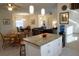 Open kitchen island, granite countertops and view into living room at 25115 Esmeralda Ct, Punta Gorda, FL 33955