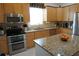 Bright kitchen, stainless steel appliances and light wood cabinets at 25115 Esmeralda Ct, Punta Gorda, FL 33955