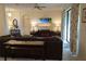 Living room with sectional sofa, large TV, and access to patio at 25115 Esmeralda Ct, Punta Gorda, FL 33955