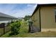 View of the side yard, featuring meticulously maintained landscaping, adding charm and curb appeal at 25115 Esmeralda Ct, Punta Gorda, FL 33955