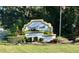 Welcoming Deep Creek deed-restricted community sign with lush landscaping and a manicured lawn at 25228 Nocturne Ln, Punta Gorda, FL 33983