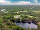 Property view showcasing home's location and surrounding land at 27545 Monte Cristo Blvd, Punta Gorda, FL 33955