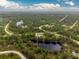Property view showcasing home's location and surrounding land at 27545 Monte Cristo Blvd, Punta Gorda, FL 33955