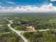 Property view showcasing home's location and surrounding land at 27545 Monte Cristo Blvd, Punta Gorda, FL 33955