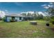 Large backyard with a hot tub and screened-in pool at 27545 Monte Cristo Blvd, Punta Gorda, FL 33955