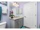 Bathroom features a vanity with a marble countertop and a large mirror at 27545 Monte Cristo Blvd, Punta Gorda, FL 33955