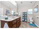 Bathroom features a double vanity, marble countertop, and tiled floor at 27545 Monte Cristo Blvd, Punta Gorda, FL 33955