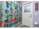 Bathroom with exterior access and decorative shower curtain at 27545 Monte Cristo Blvd, Punta Gorda, FL 33955