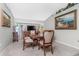 Formal dining room featuring a wood table, carpeting, and large artwork at 27545 Monte Cristo Blvd, Punta Gorda, FL 33955