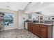 Kitchen features wood cabinets, granite countertops, and a view to the backyard at 27545 Monte Cristo Blvd, Punta Gorda, FL 33955