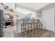 Kitchen island with seating and views into the main living area at 27545 Monte Cristo Blvd, Punta Gorda, FL 33955