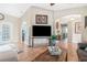 Living room with hardwood floors, large TV, and open floor plan at 27545 Monte Cristo Blvd, Punta Gorda, FL 33955