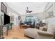 Living room with hardwood floors, leather couch, and chaise lounge at 27545 Monte Cristo Blvd, Punta Gorda, FL 33955