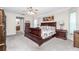 Spacious main bedroom with a sleigh bed and private access to the pool at 27545 Monte Cristo Blvd, Punta Gorda, FL 33955