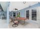 Covered patio with a long wooden table, great for outdoor dining at 27545 Monte Cristo Blvd, Punta Gorda, FL 33955