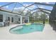 Relaxing screened-in pool area with plenty of space for sunbathing at 27545 Monte Cristo Blvd, Punta Gorda, FL 33955