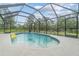 Inviting kidney-shaped pool with a screened enclosure at 27545 Monte Cristo Blvd, Punta Gorda, FL 33955