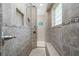 Large walk-in shower with tiled walls and built-in seat at 27545 Monte Cristo Blvd, Punta Gorda, FL 33955