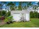 Large storage shed with a roll-up door and bicycle at 27545 Monte Cristo Blvd, Punta Gorda, FL 33955